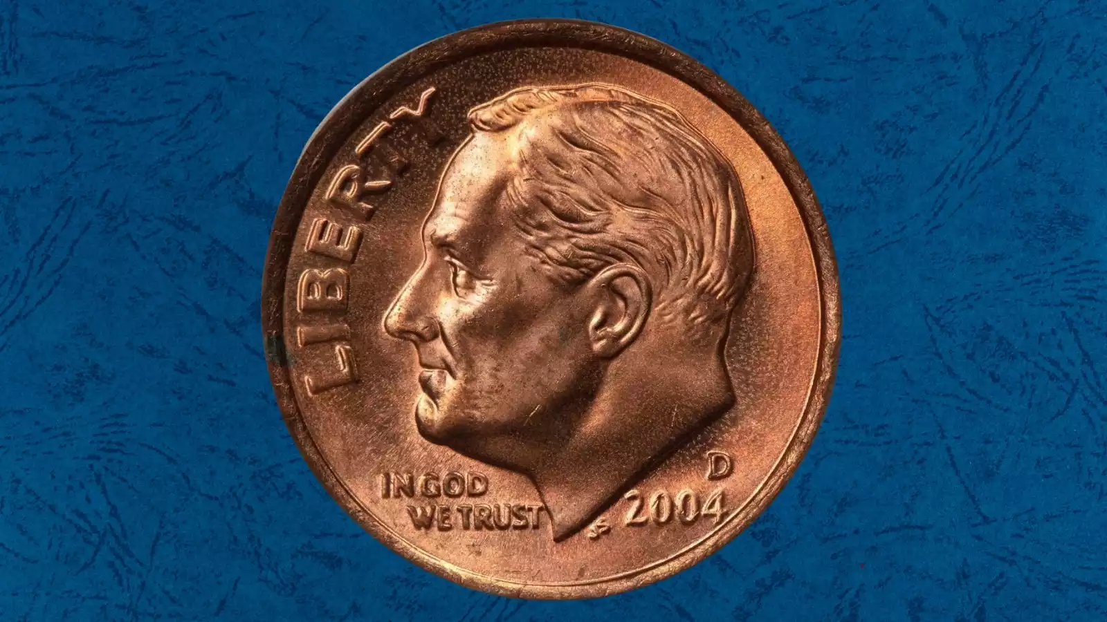 2004-D Roosevelt dime improperly annealed planchet error showing distinctive reddish-copper uniform discoloration across the entire coin face
